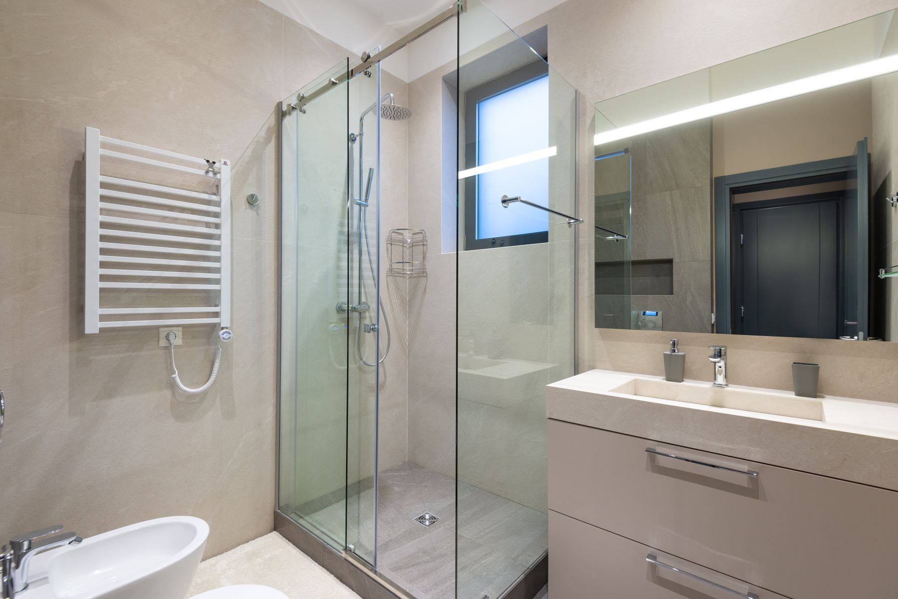 Modern bathroom with a glass shower and floating vanity
